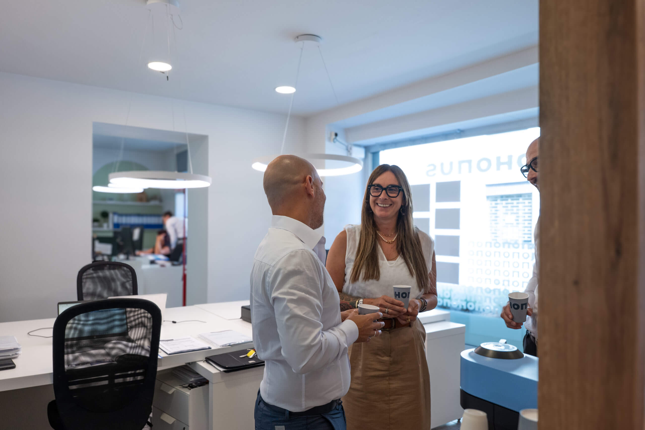 Beplano | The House of Brands > a group of people standing in a room